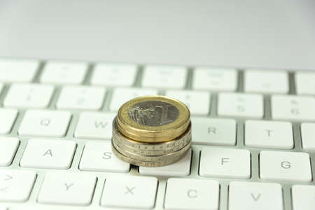 Euro coin and keyboardの写真素材