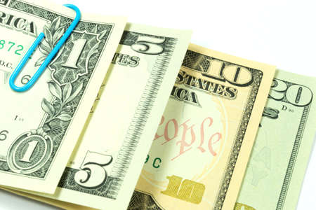 Dollar bills and paper clip