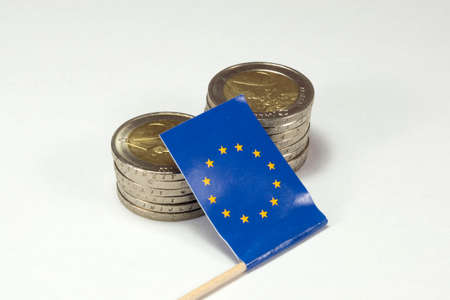 Euro coins and European Union flagの写真素材