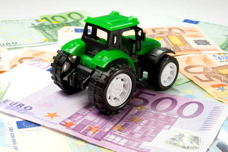 A tractor and many euro billsの写真素材