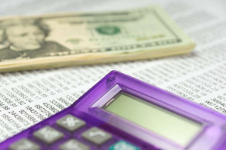 Money dollar, calculator and graphsの写真素材