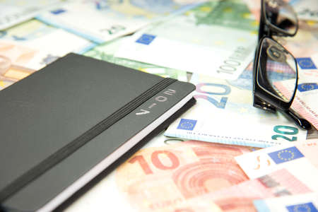 Euro money, calendar and glassesの写真素材
