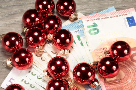 Euro money and Christmas baublesの写真素材