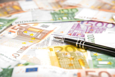 Euro money and a penの写真素材
