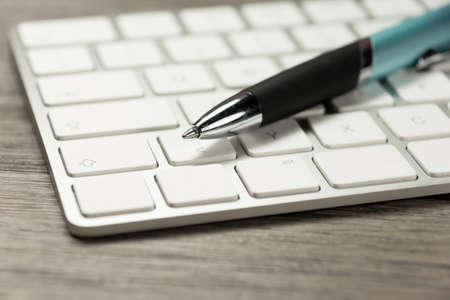 A computer and penの写真素材