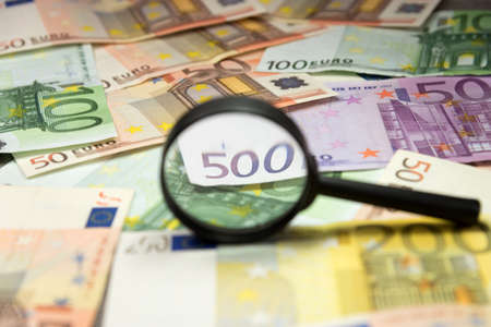 Euro money and magnifying glassの写真素材