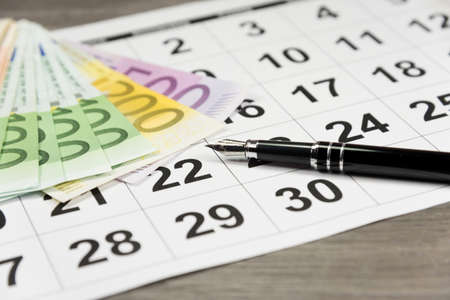 Euro money, calendar and penの写真素材