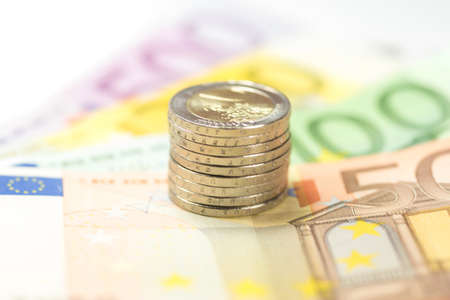 Many euro banknotes and coins