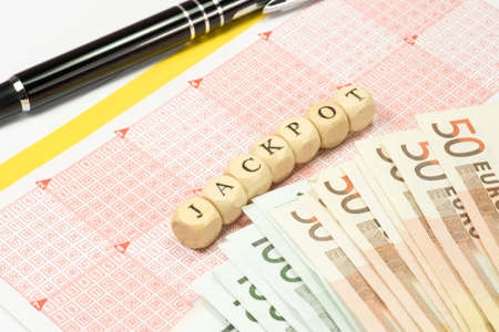 A German lottery ticket and the word jackpotの写真素材