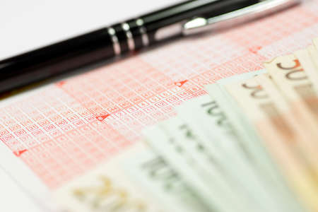A German lottery ticket and many euro billsの写真素材