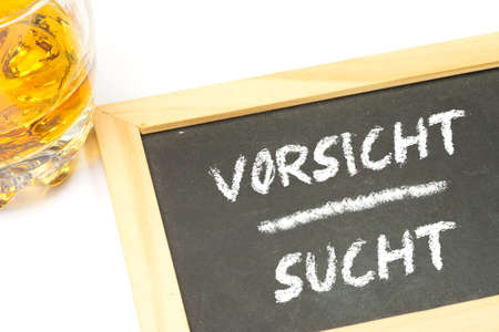 Alcohol and a warning of alcoholismの写真素材