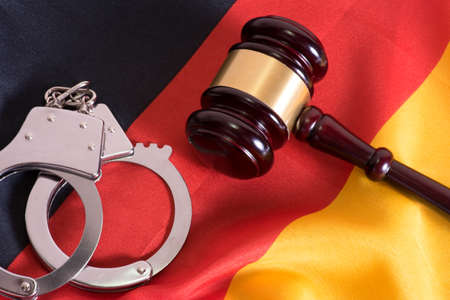 German flag, handcuffs and a gavelの写真素材