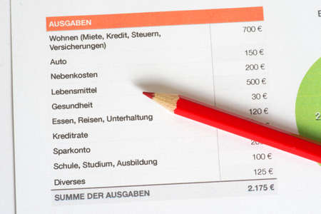 Nutrition table and red crayonの写真素材