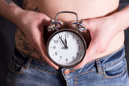 A woman and an alarm clock for the desire of children