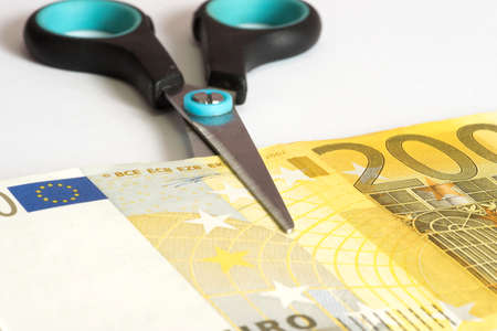 Euro money and scissorsの写真素材