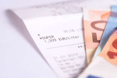 Euro money and receipt for refueling