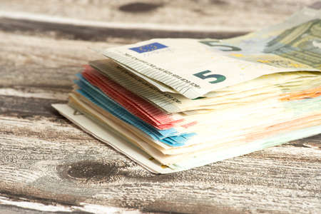 Euro banknotes on the tableの写真素材