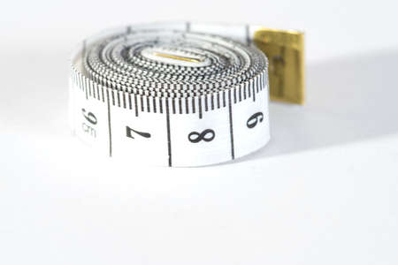 Measuring tape on the white backgroundWの写真素材