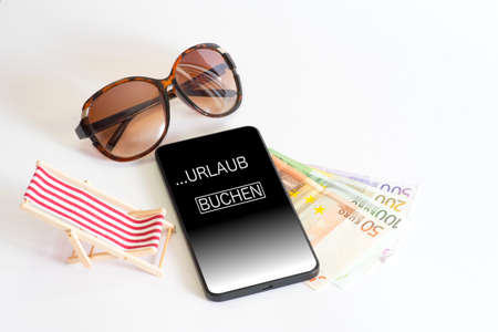 Sunglasses, money and vacation beeches about a smartphoneの写真素材