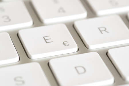 White keyboard with a stamp of the euro