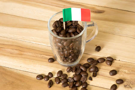 Italian flag and cup of coffee beansの写真素材