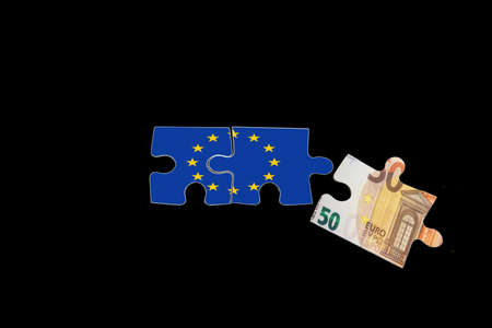European union flag and euro money on puzzlesの写真素材