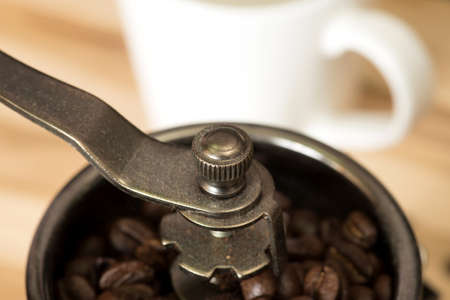 Grinder with coffee grainsの写真素材