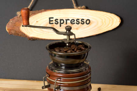 Coffee grinder and placard with espresso signの写真素材
