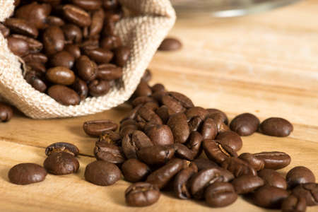 Ripped coffee grains from a jute bag