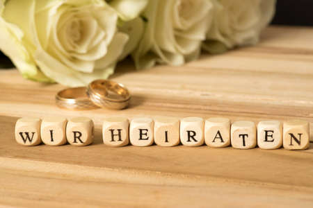 Wedding invitation and white rosetteの写真素材