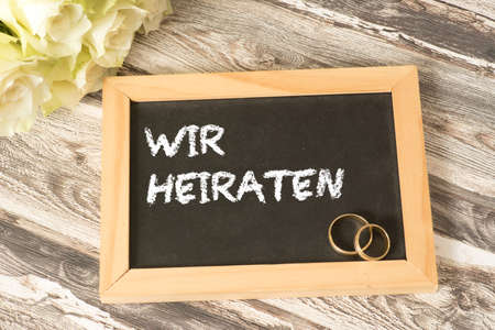 Wedding invitation and white rosetteの写真素材