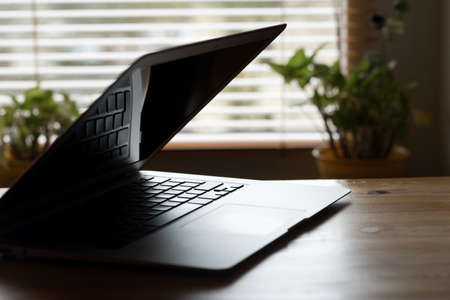 A laptop on a table in the office