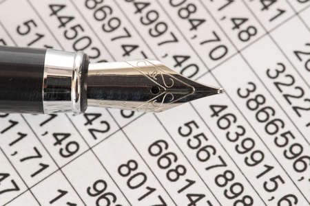 A spreadsheet and a fountain pen
