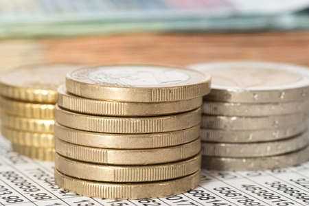 Euro coins and a spreadsheetの写真素材
