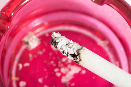 A cigarette in an ashtrayの写真素材