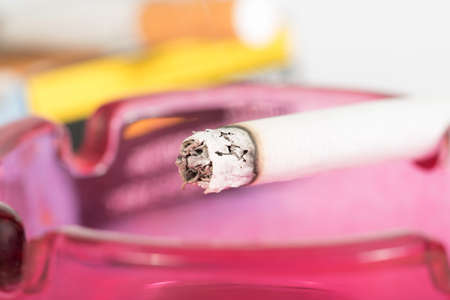 A cigarette in an ashtrayの写真素材
