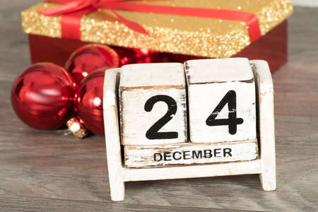 A calendar at Christmas, Christmas balls and a presentの写真素材