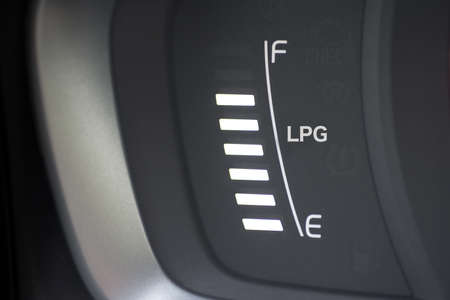 Fuel gauge from a car with flの写真素材