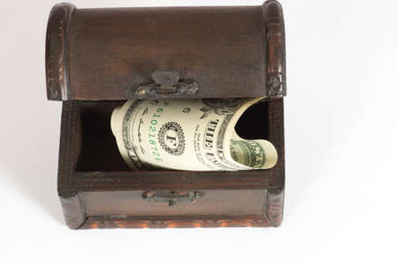 A treasure chest and dollar bills
