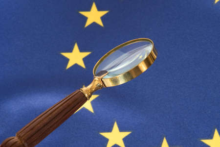 Flag of the European Union EU and a magnifying glass