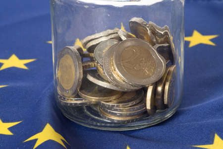 Flag of the European Union EU and coins in a mason jar