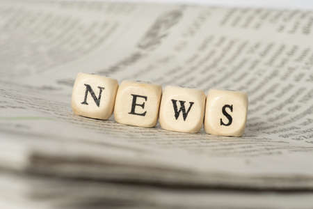 A newspaper and the word newsの写真素材