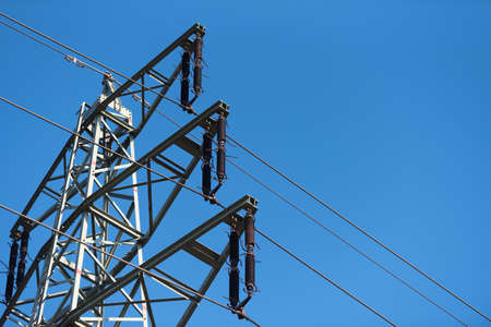 A high voltage pylon and blue sky