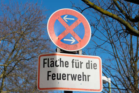 A no-stop sign indicating the area for the fire departmentの写真素材