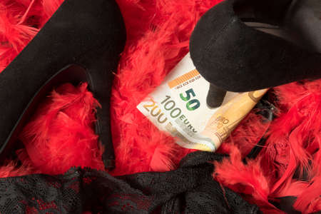 High heels, lingerie and money for paid sexの写真素材