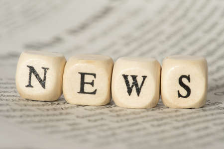 A newspaper and the word newsの写真素材