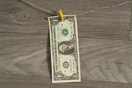 A dollar bill on a clotheslineの写真素材