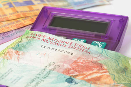 A calculator and Swiss Francの写真素材