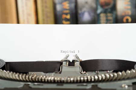 Typewriter, books and the beginning of the book Writingの写真素材
