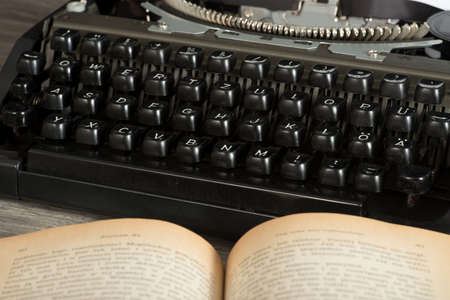 A typewriter and books